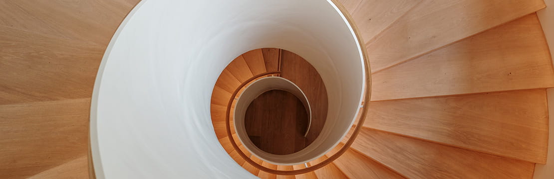 Spiral staircase viewed from above, symbolizing rising Treasury yields